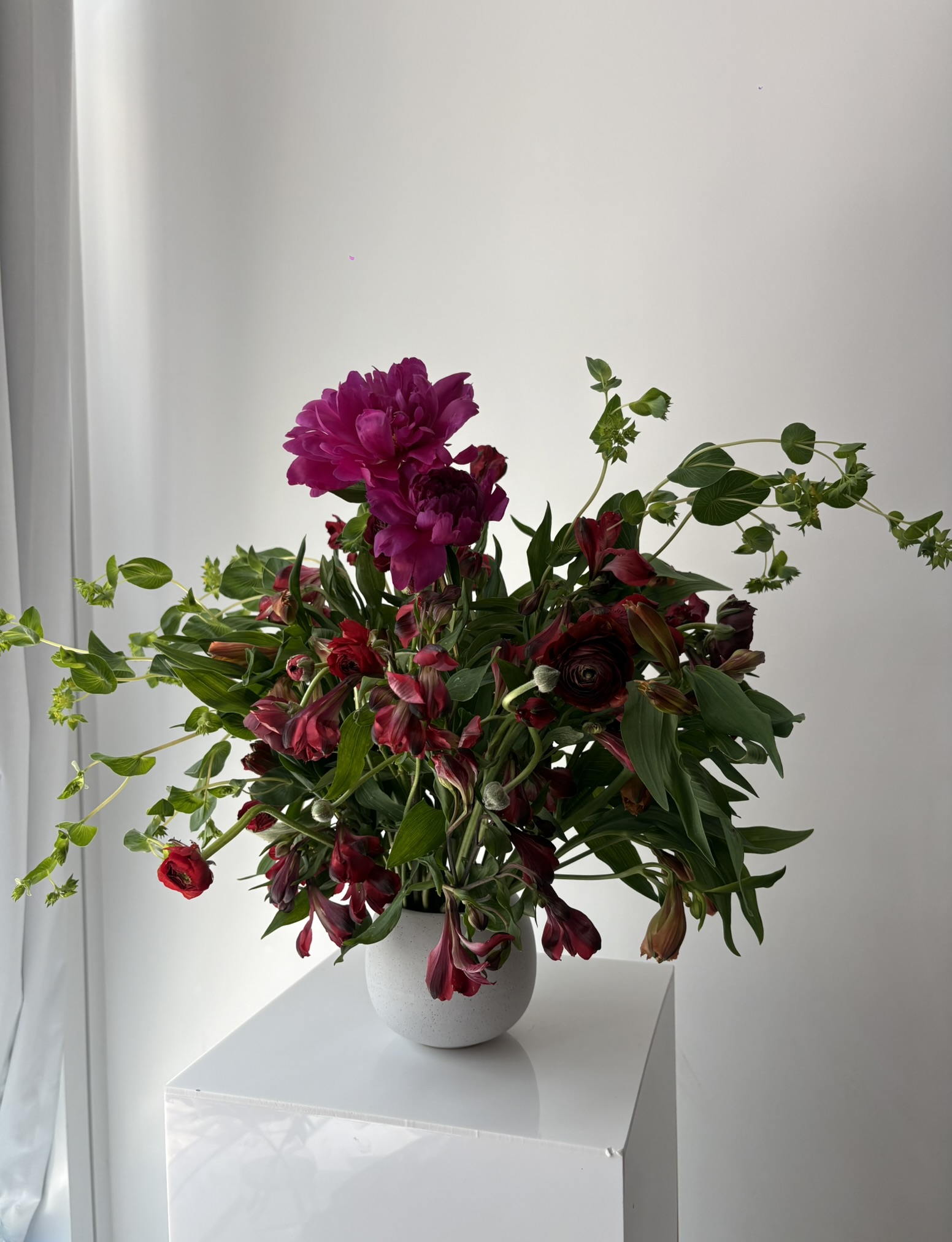 Moody peony and alstroemeria sculptural arrangement by Wilted NYC