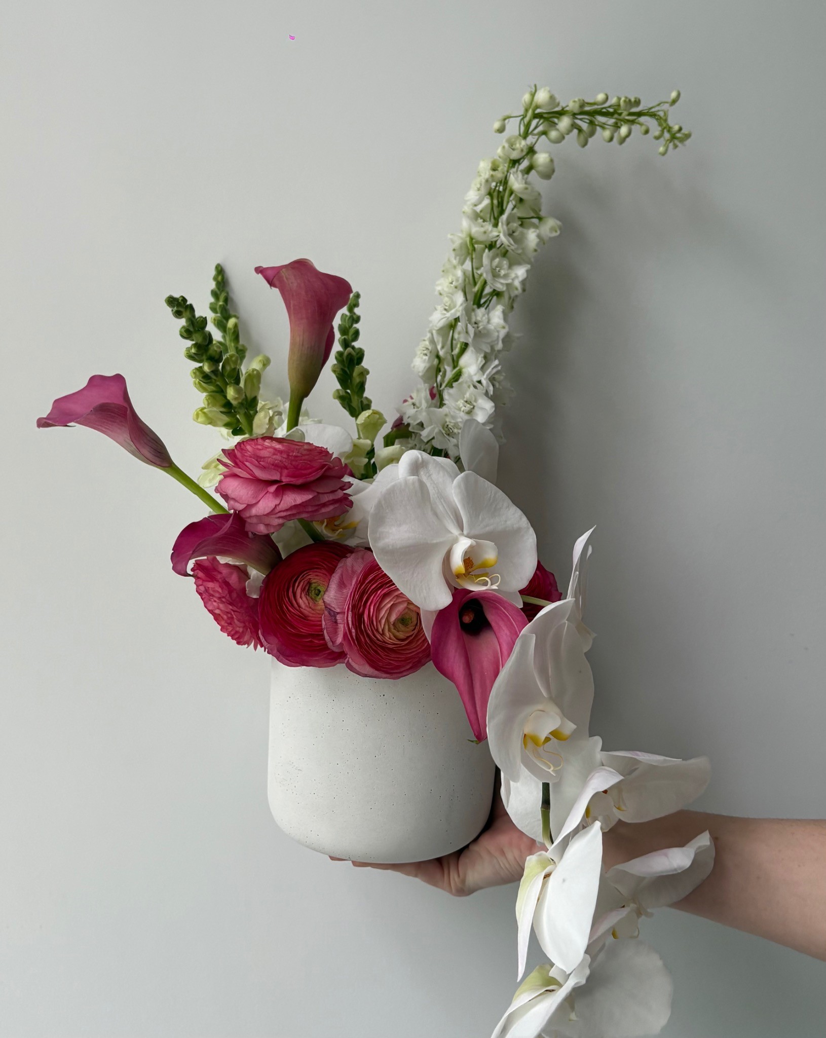 Wilted NYC sculptural floral arrangement with calla lilies and orchids