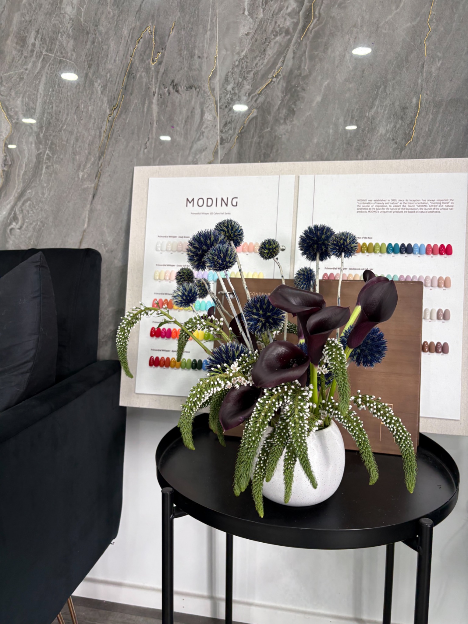 Dark calla lily and sculptural floral arrangement for a nail salon placement by Wilted NYC